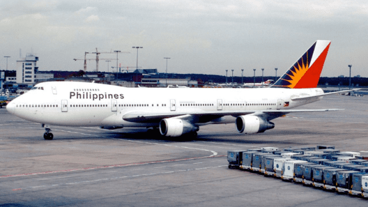 a large white airplane on a runway