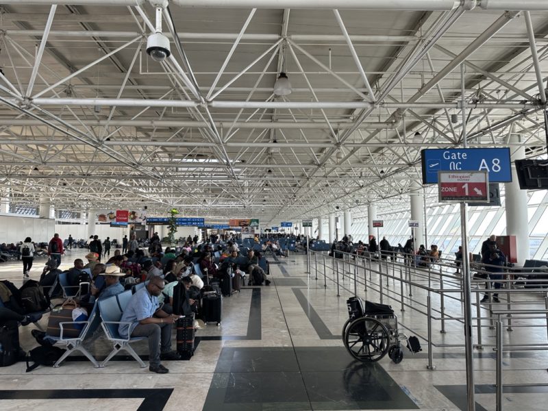 a group of people sitting in a terminal