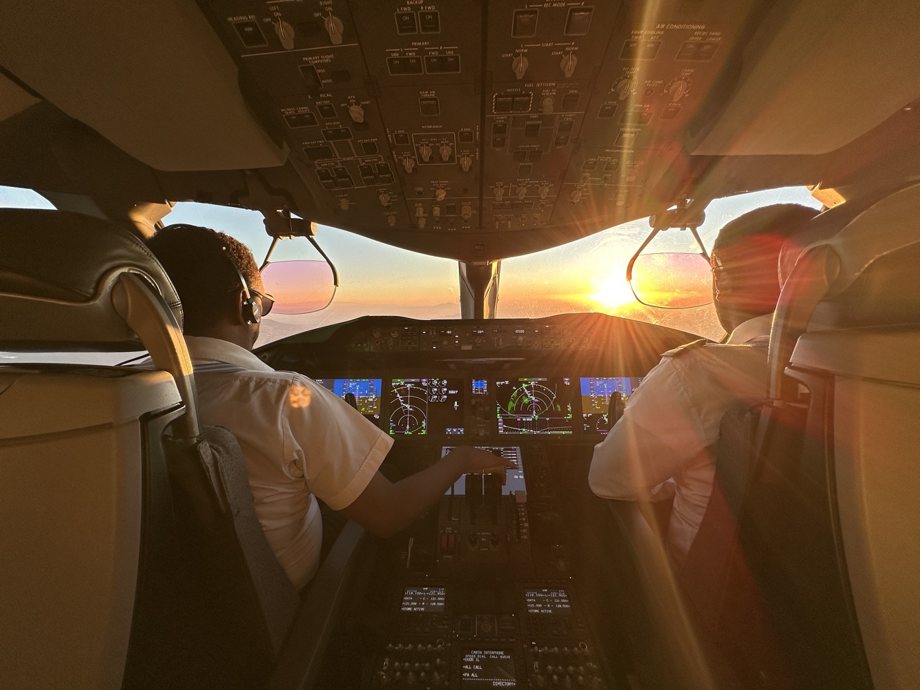 people in the cockpit of an airplane