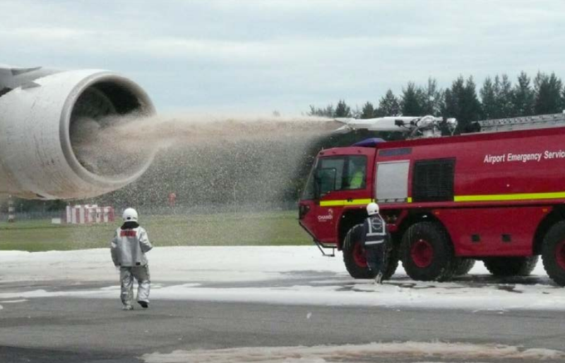 a fire truck spraying sand