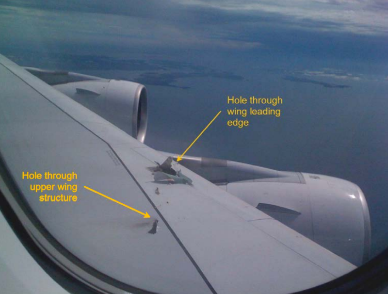 an airplane wing with text and words