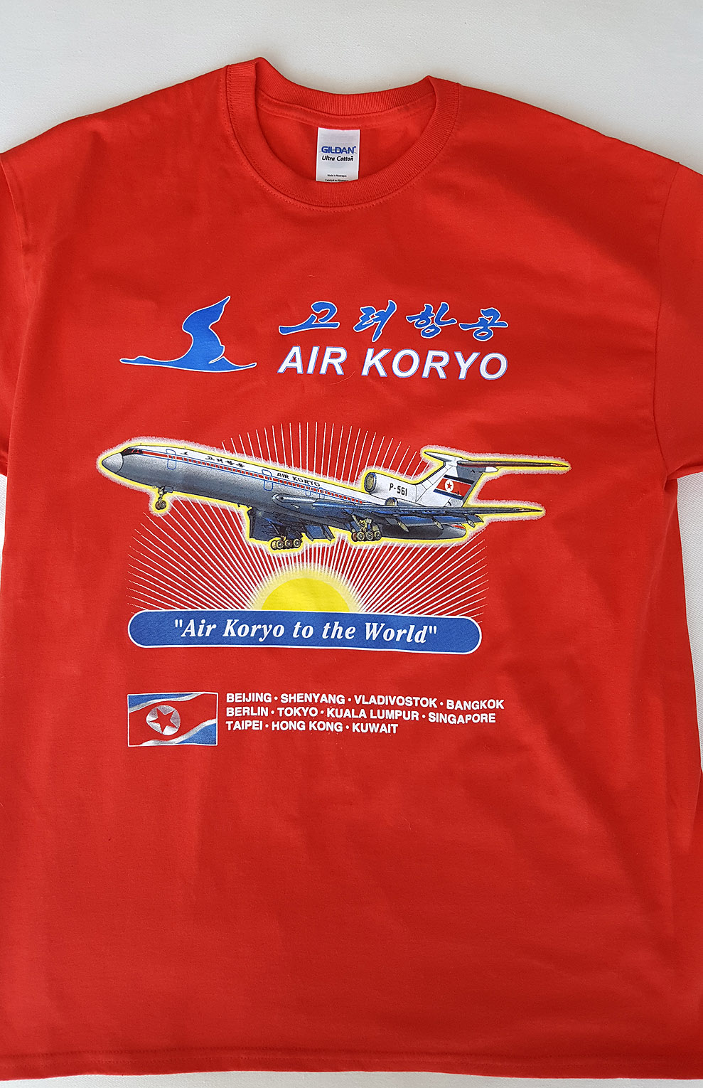 a red shirt with a picture of an airplane