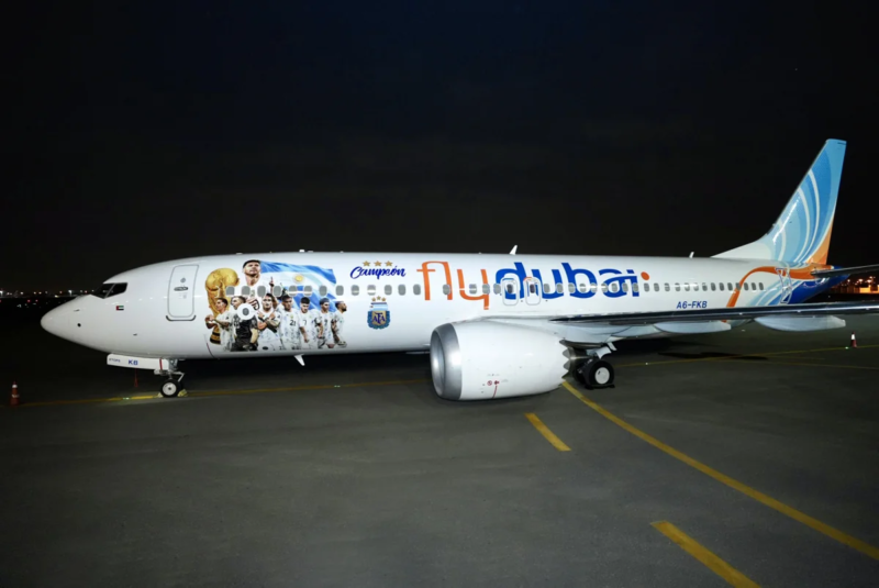 a white airplane with images on it