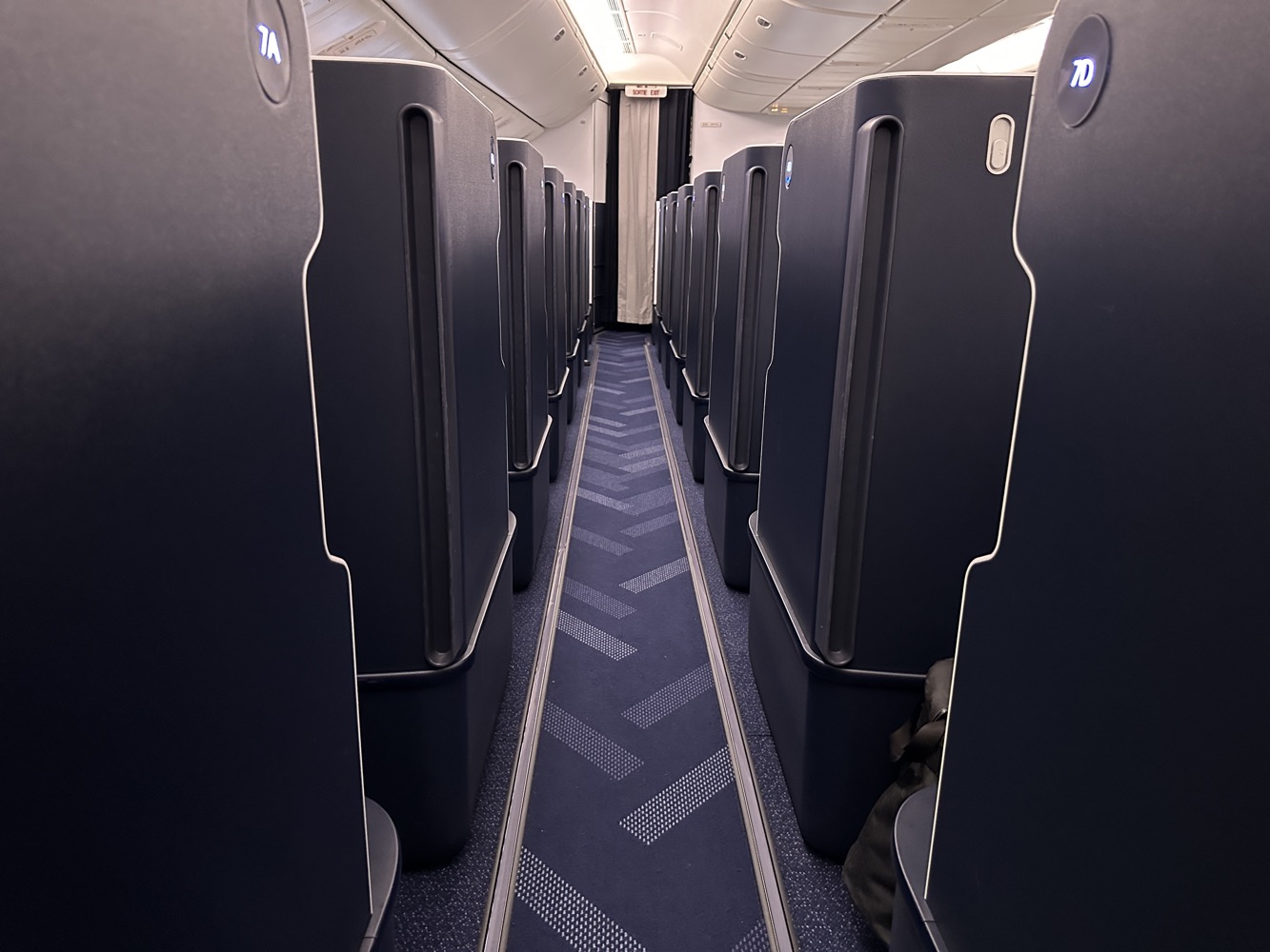 a row of rows of seats in a plane
