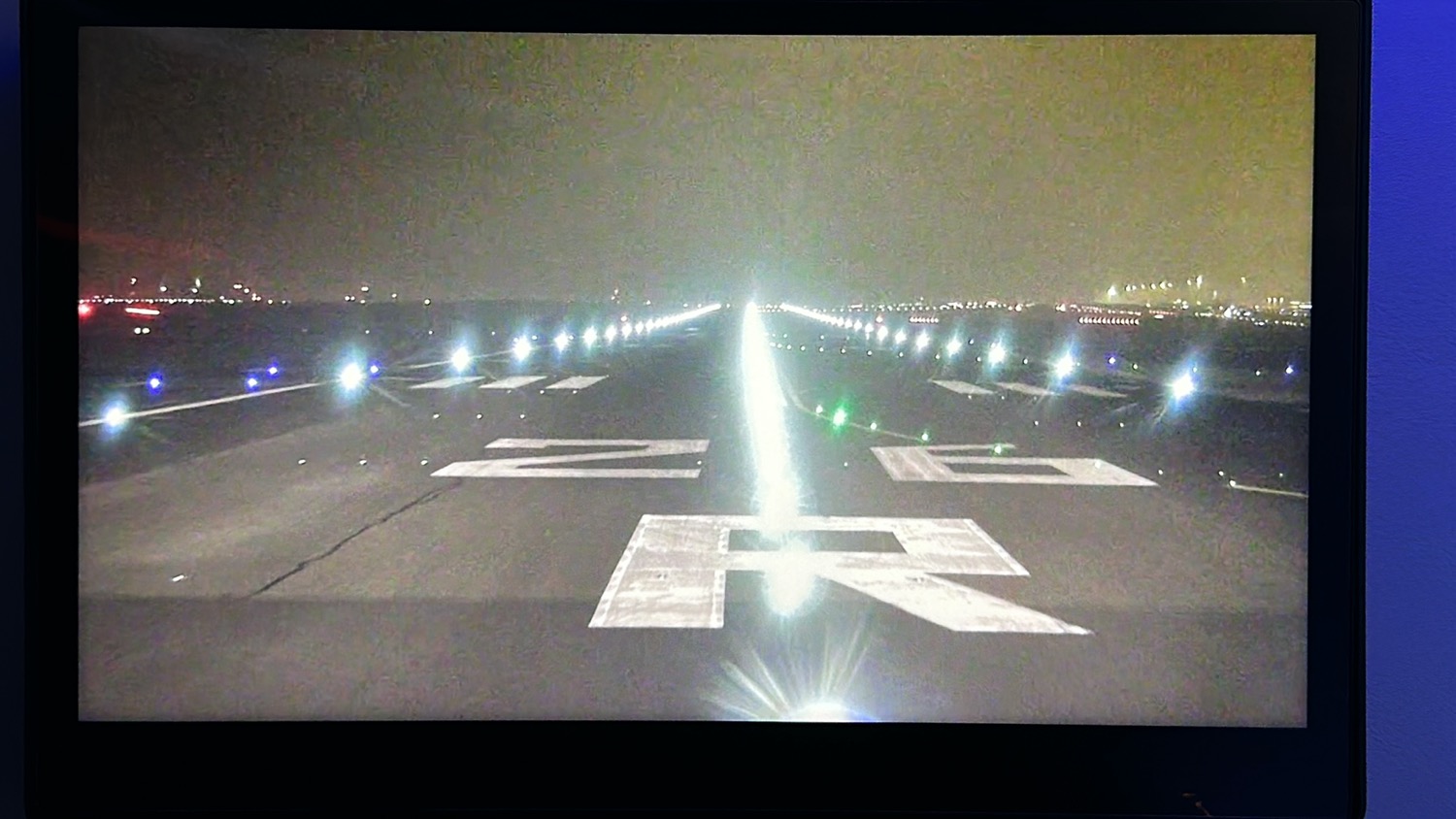 a runway with lights on