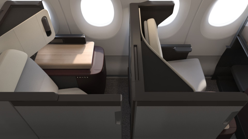 a seat and desk in a plane