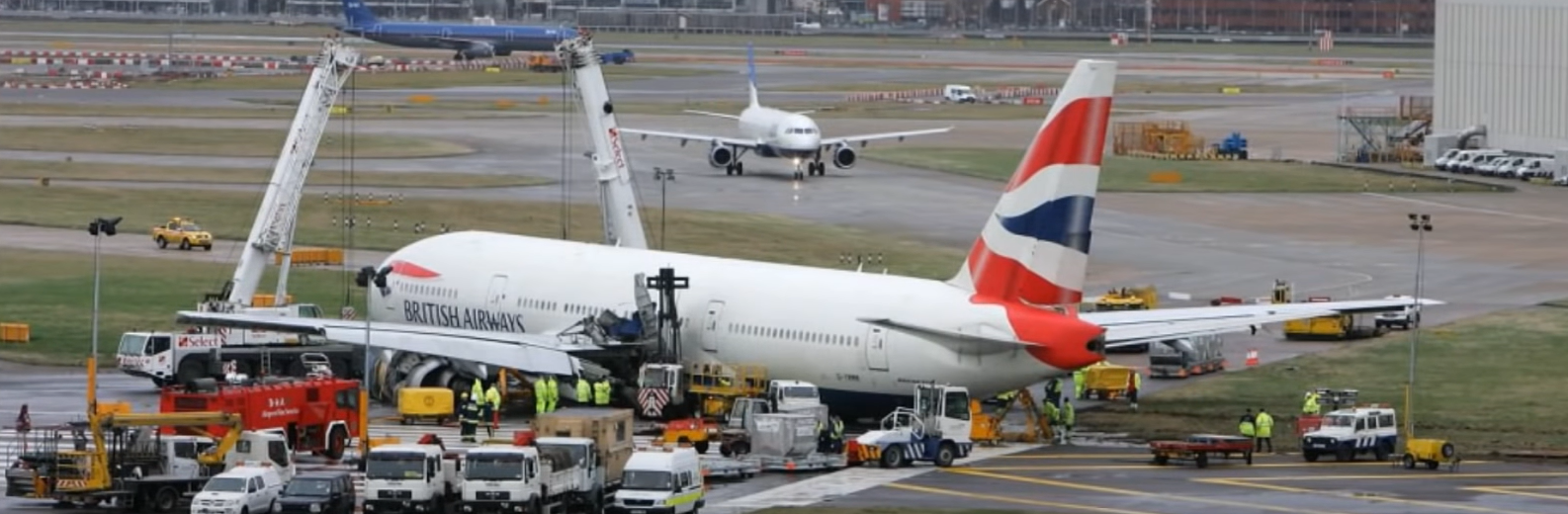 a group of airplanes at an airport