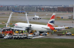 a group of airplanes at an airport