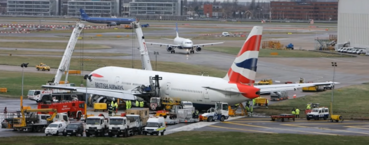 a group of airplanes at an airport