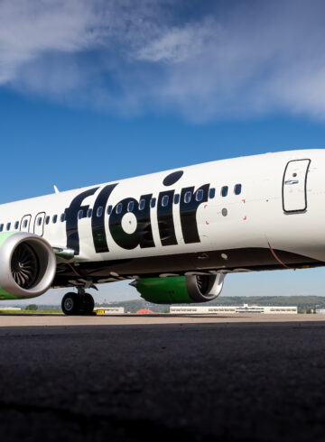 a white airplane on a runway