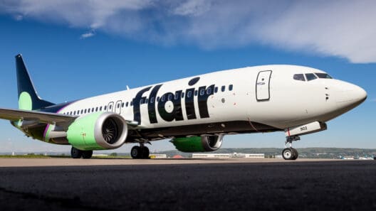 a white airplane on a runway