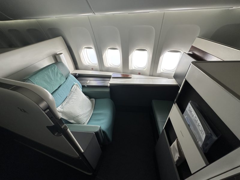 The Korean Air First Class seat is spacious and very long. There is a privacy door that can be operated during the flight.