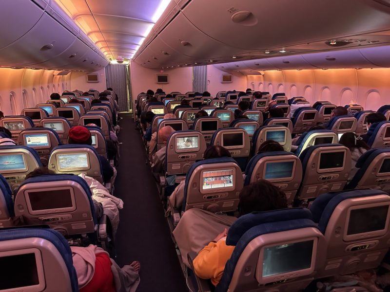 a group of people sitting in an airplane