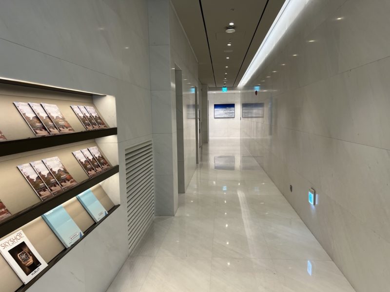 a hallway with a white tile floor