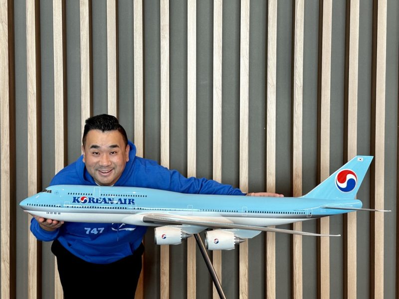 a man holding a model airplane