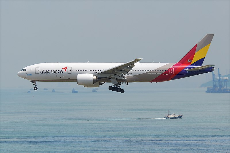 an airplane flying over the water