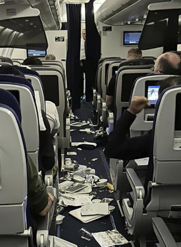 a group of people sitting on an airplane