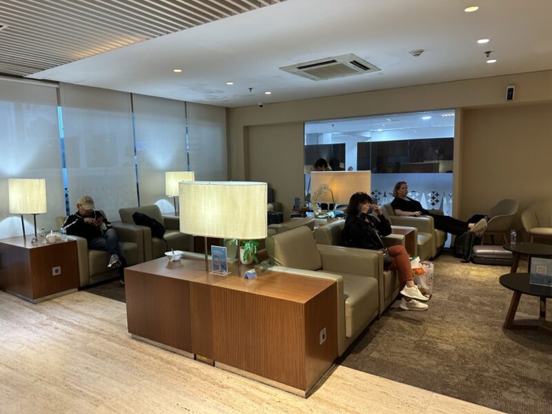 a group of people sitting in a lounge area