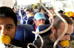 a group of people sitting on a plane