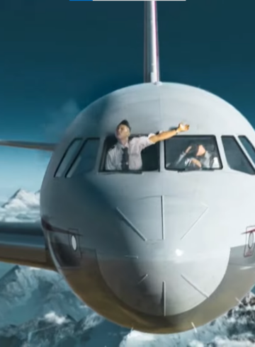 a man in the window of a plane