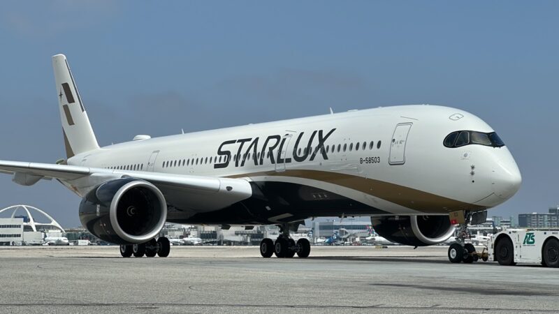 a large white airplane on a runway