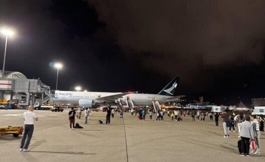 a large airplane on the tarmac at night