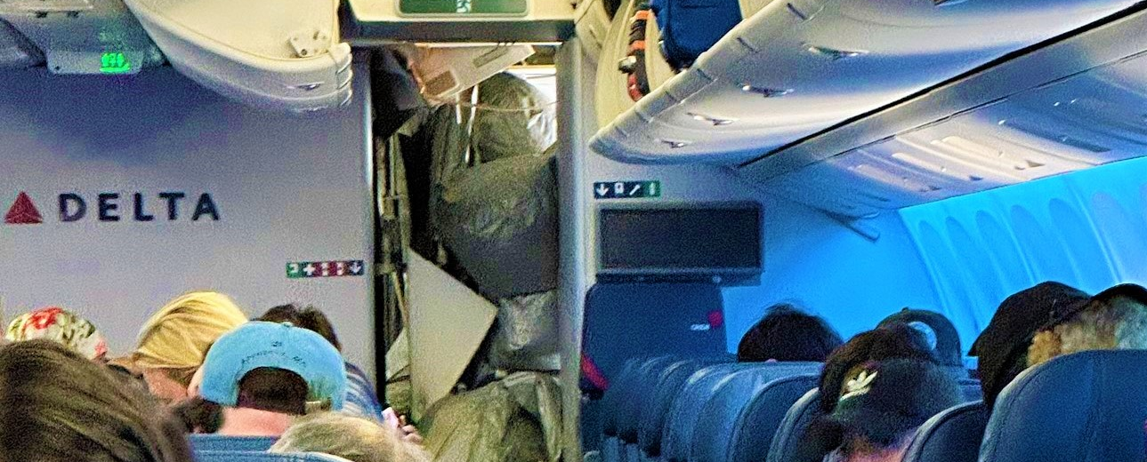 a group of people sitting in an airplane