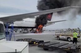 a plane on fire with smoke coming out of the wing