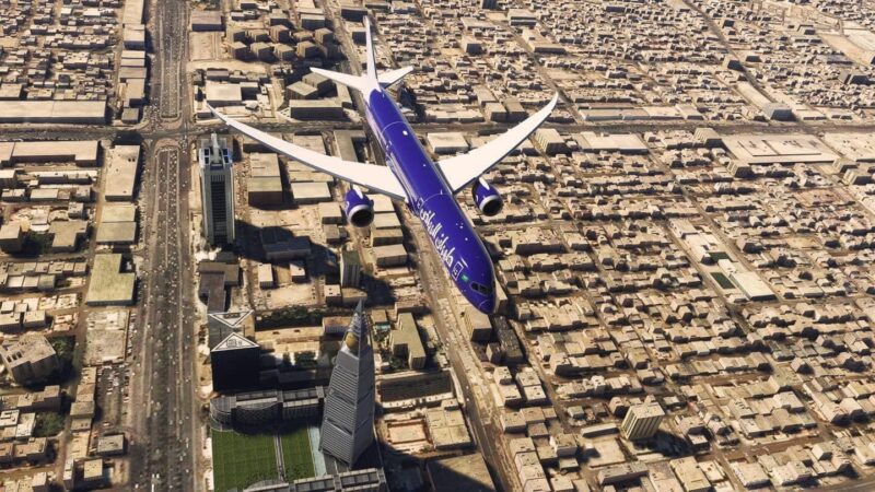 an airplane flying over a city