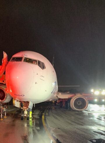 a plane on the runway at night