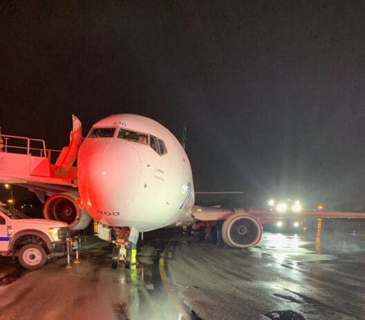 a plane on the runway at night