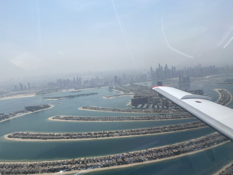 an airplane wing and water in the air