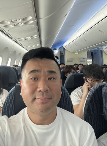 a man taking a selfie in an airplane