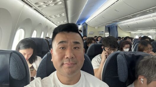 a man taking a selfie in an airplane