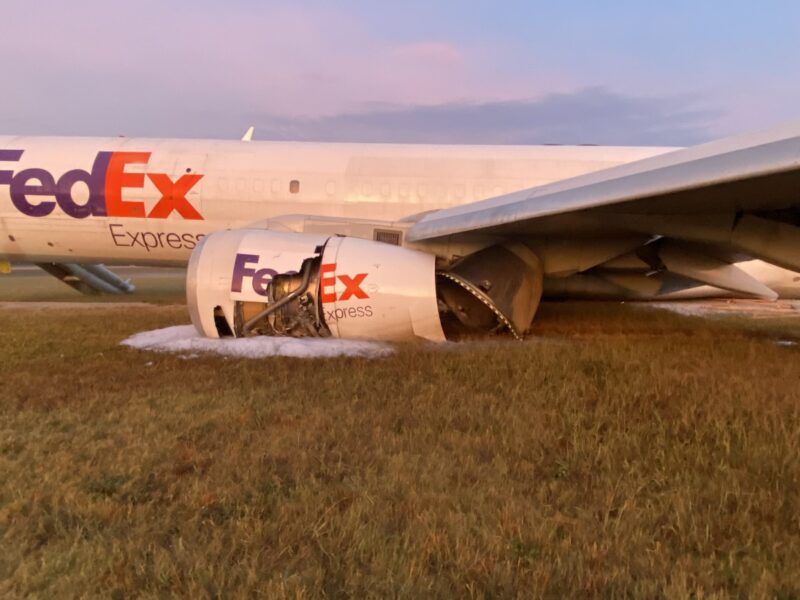 an airplane with engine on the ground