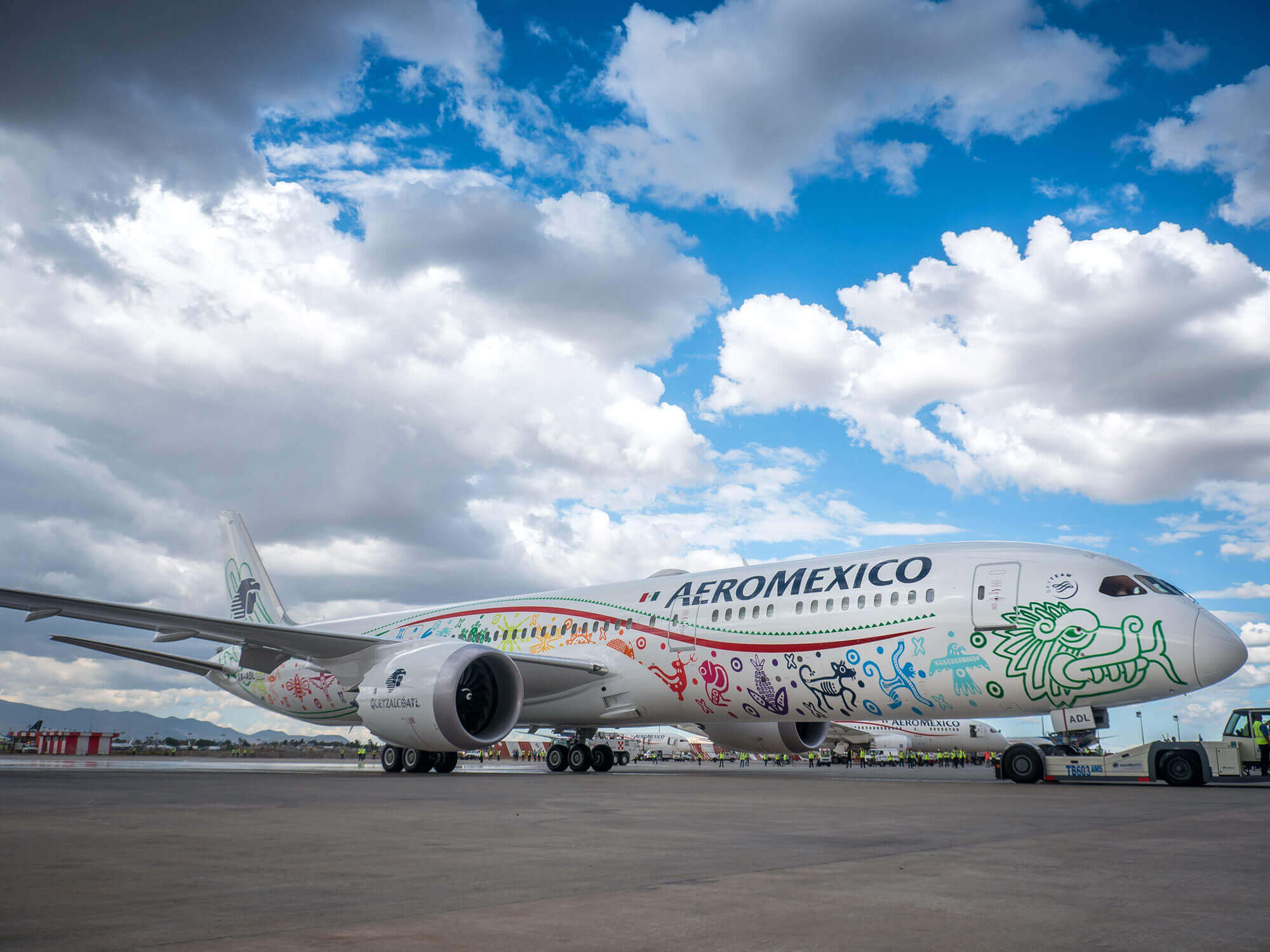 a large airplane with colorful designs on it