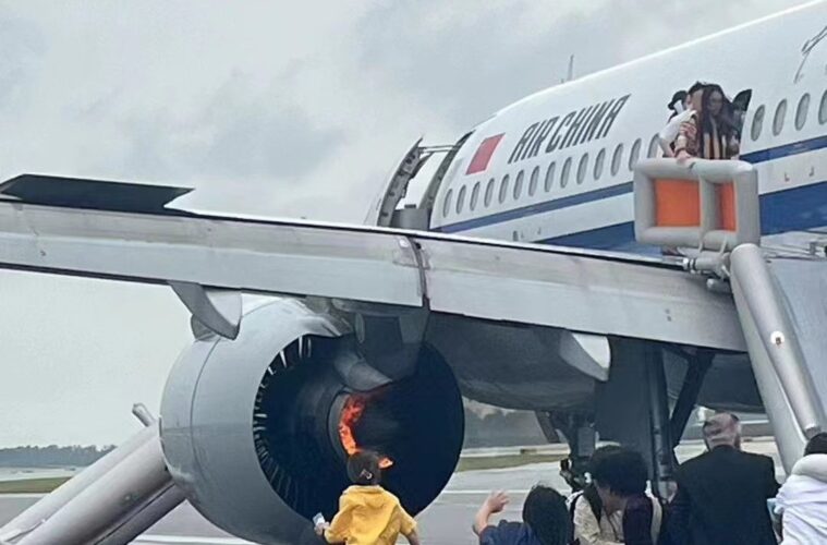 a group of people standing around an airplane