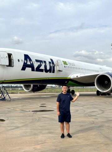 a man standing in front of an airplane