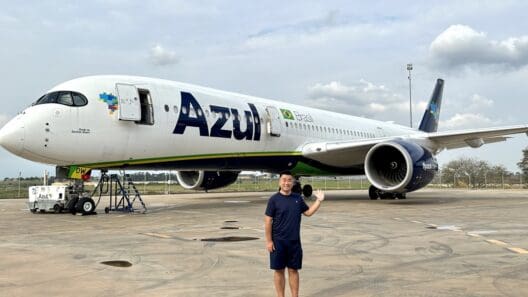 a man standing in front of an airplane