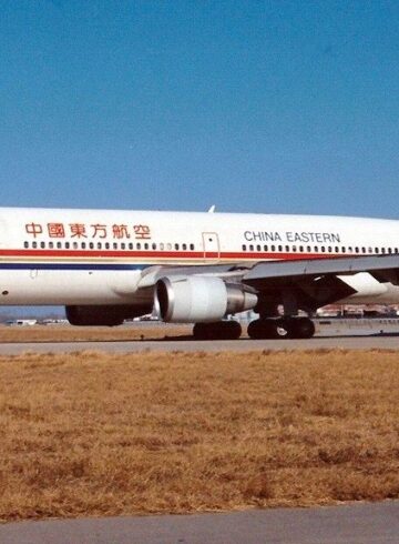 a white airplane on a runway