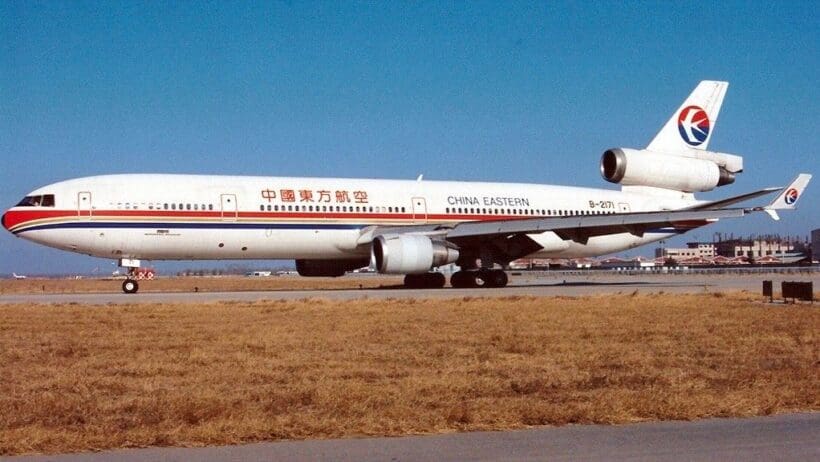 a white airplane on a runway