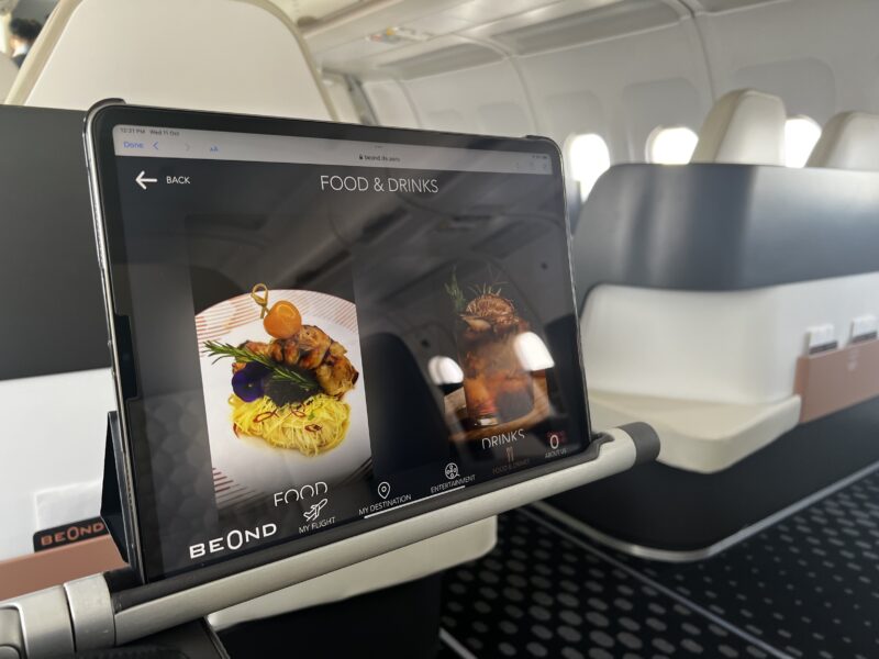 a tablet on a stand in a plane