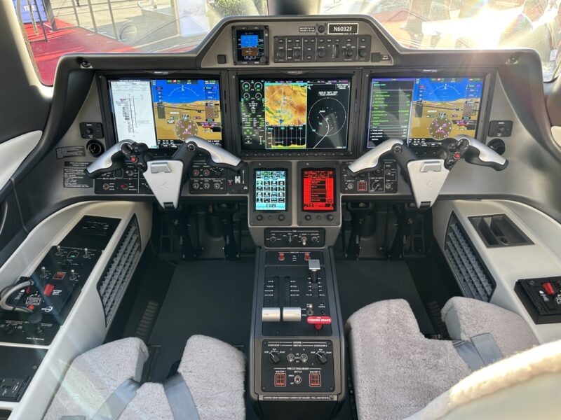 the cockpit of an airplane with multiple screens