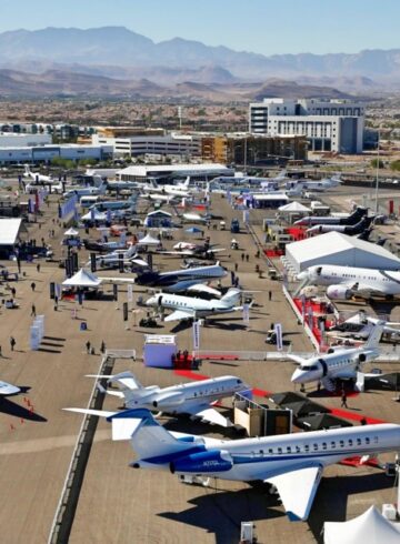 an aerial view of an airport with many airplanes