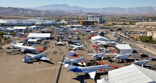 an aerial view of an airport with many airplanes