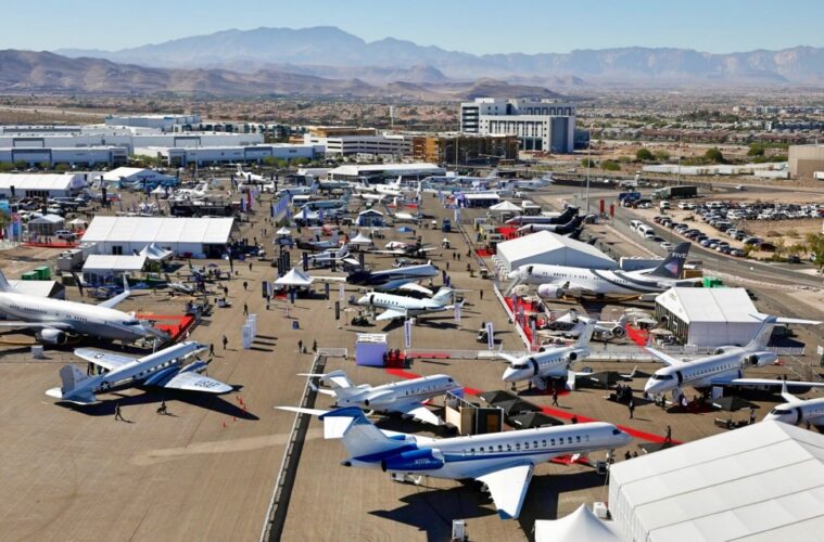 an aerial view of an airport with many airplanes