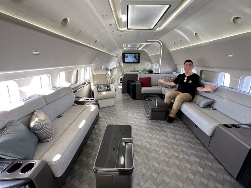 a man sitting on a couch in a plane