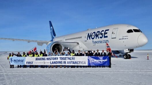 a group of people standing in front of a plane