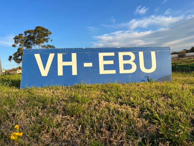 a blue sign in the grass