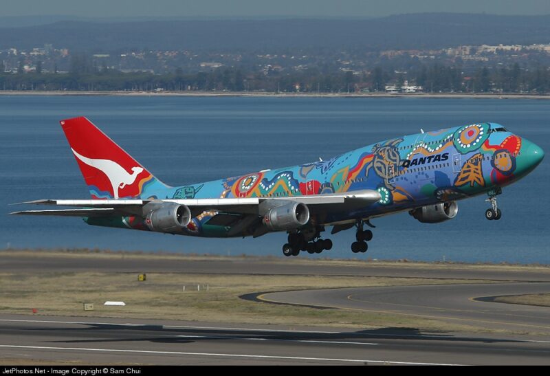 a colorful airplane taking off